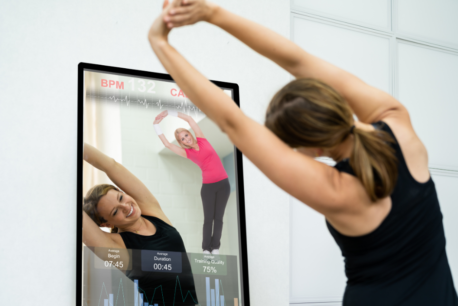 person using smart mirror for exercise as an example of bleisure technology